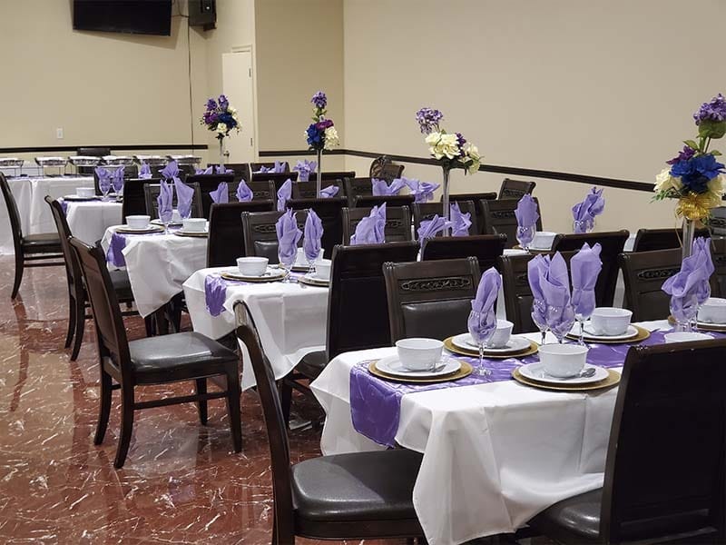 Celebration of life reception setup with tables and flowers at a Brooklyn funeral home