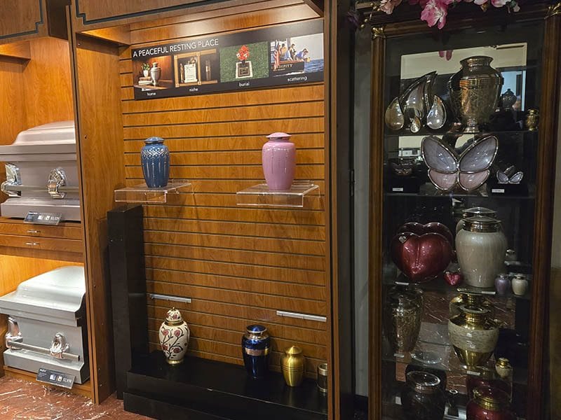Cremation urns and casket selection display at Harmony Funeral Home 2200 Clarendon Rd Brooklyn NY 11226