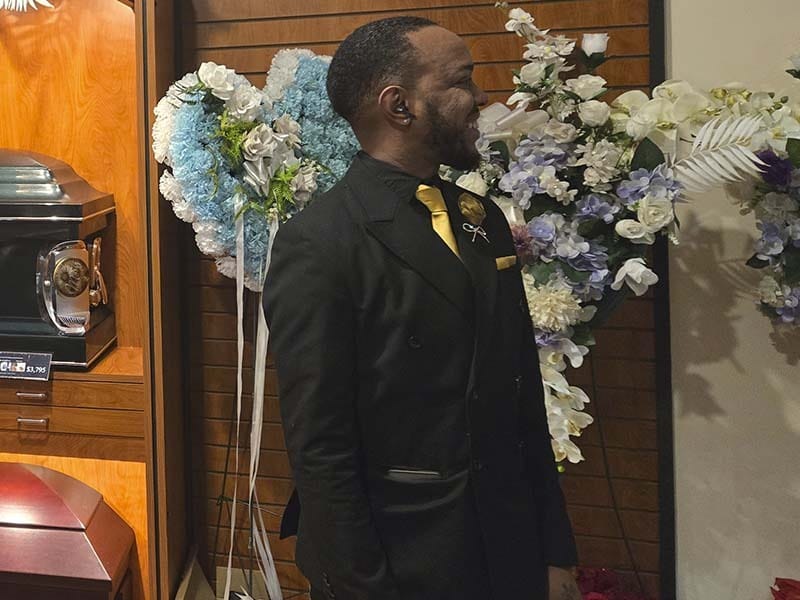 Professional funeral director supporting a grieving family at Harmony Funeral Home in Brooklyn NY