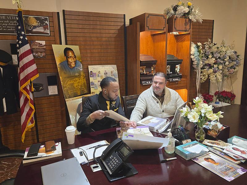 Virtual funeral arrangement meeting with Harmony Funeral Home funeral director helping a family plan services online in Brooklyn NY